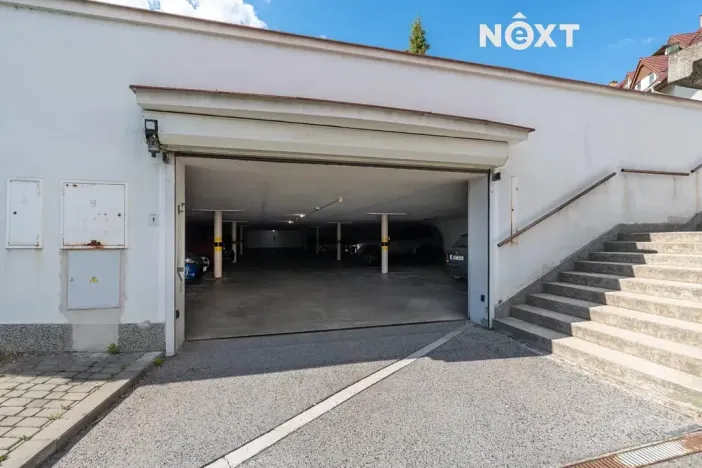 Prodej podílu garážového stání, Brno, Högrova, 11 m2